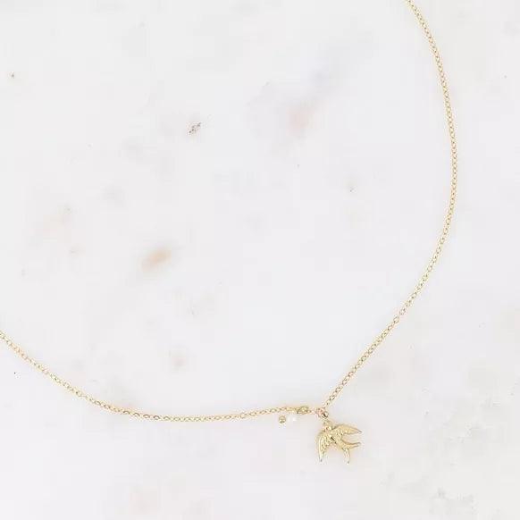 Necklace - bird in flight and small freshwater pearl.