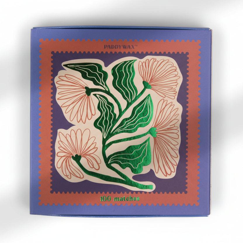 Matches box with floral design and 'PaddyWax' branding on a white background