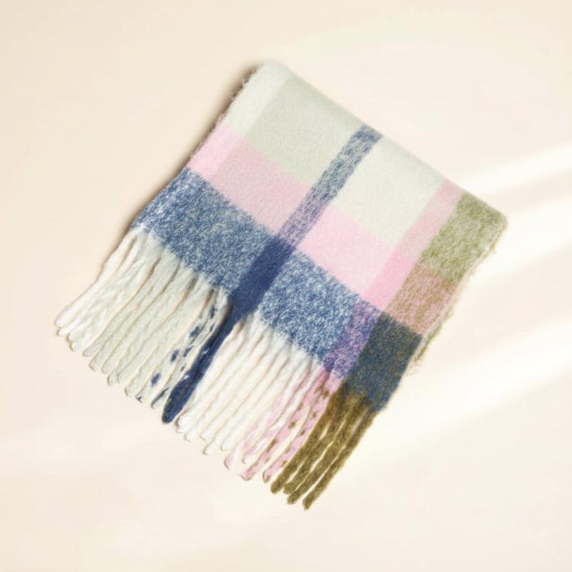 Plaid scarf with fringe on a beige background