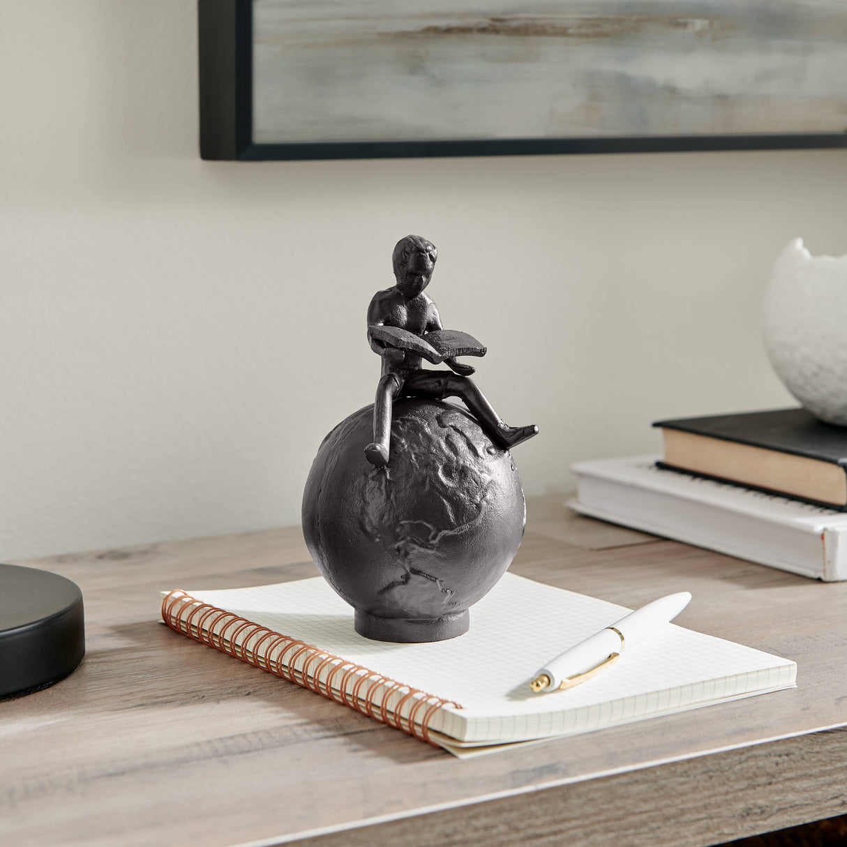 Brown Cast Iron Boy Reading on Globe Sculpture