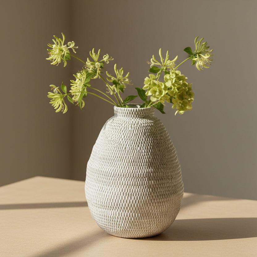 Textured gray vase on a white background