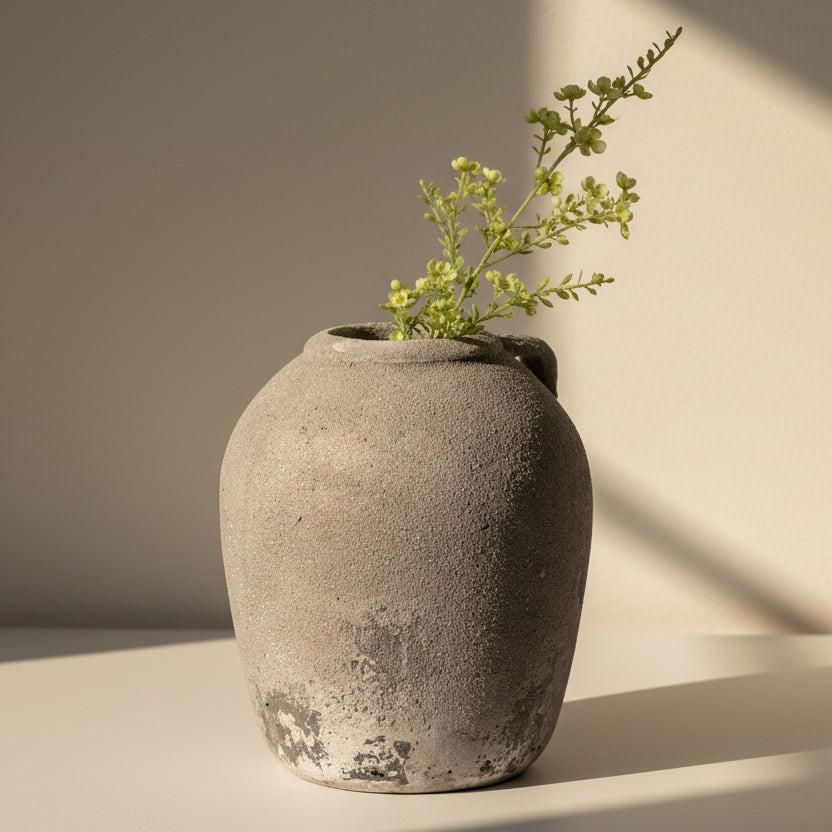 Textured gray vase on a white background