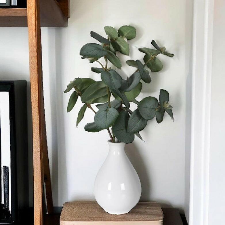 Artificial Eucalyptus in a White Vase.