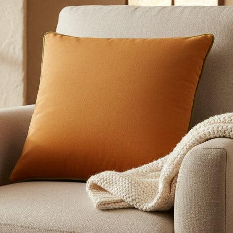 Orange cushion with a textured surface on a white background