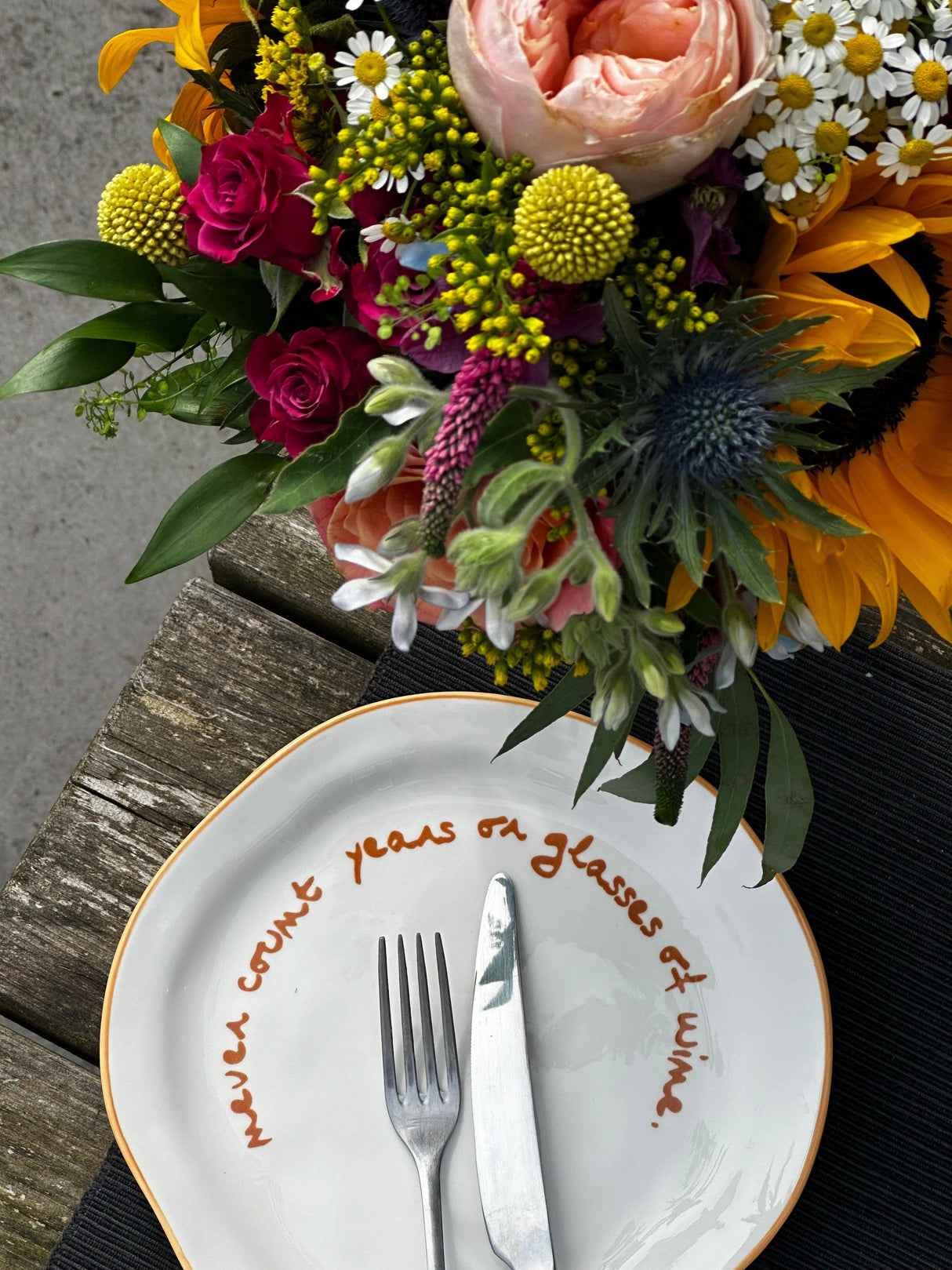 'never count years of glasses of wine.' Statement Plate