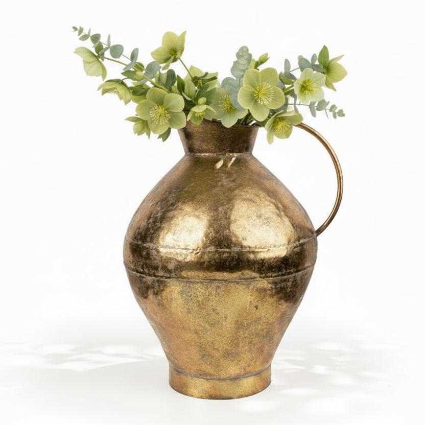 Gold pitcher on a white background