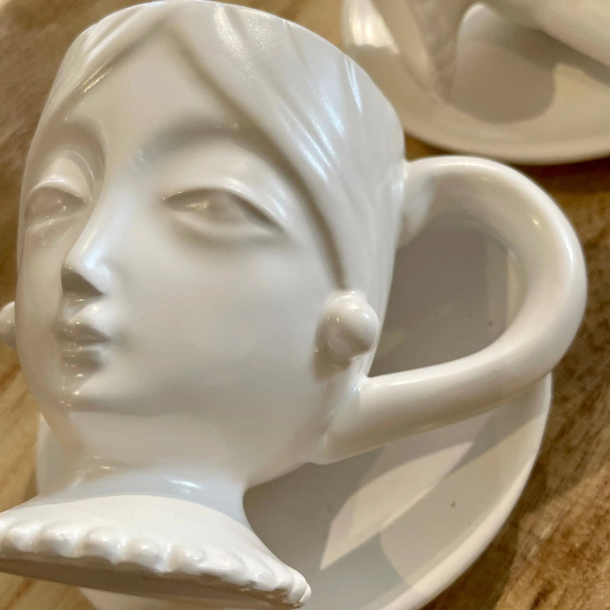 White Face Cup and Saucer.