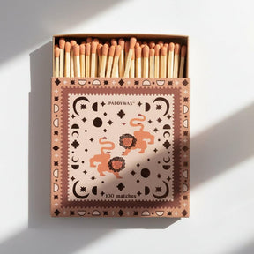 Box of matches with decorative design and 'Paddywax' branding on a white background