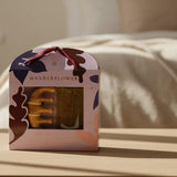 Wanderflower product set with a bottle and a container in a decorative box on a white background