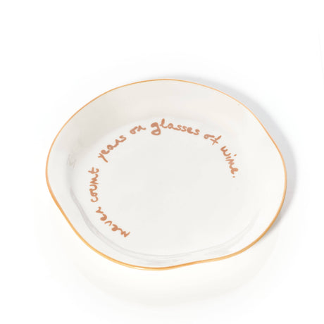 'never count years of glasses of wine.' Statement Plate