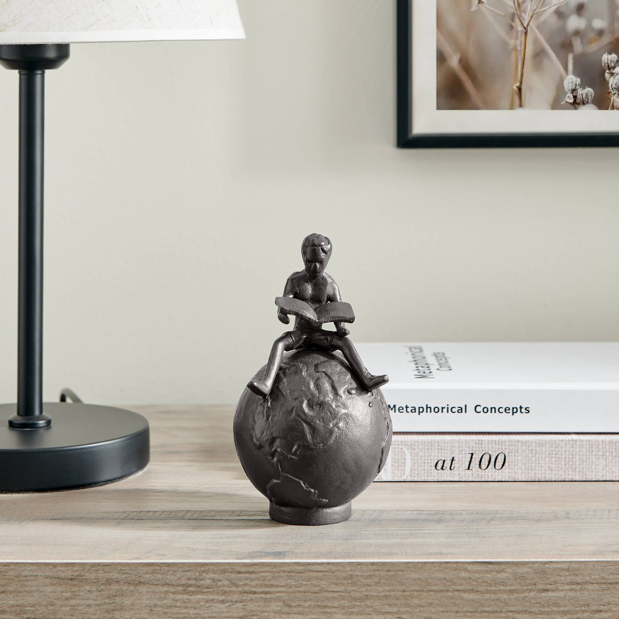 Brown Cast Iron Boy Reading on Globe Sculpture