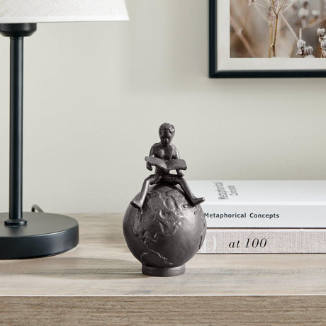 Brown Cast Iron Boy Reading on Globe Sculpture