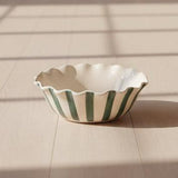 Ceramic dish with 'bon appetit' text on a white background