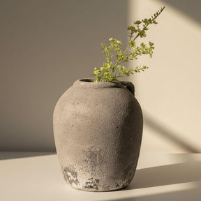 Textured gray vase on a white background