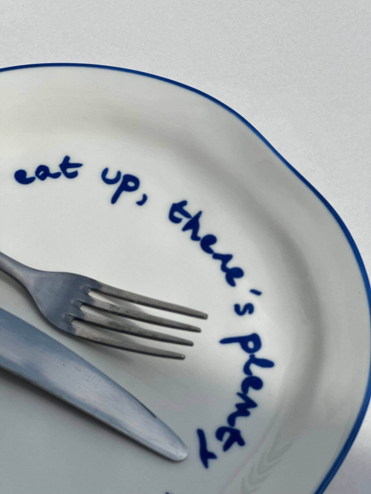 'eat up there's plenty more to go around.' Statement Plate