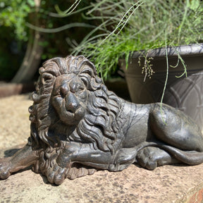 Elegant cast iron lion sculpture showcasing timeless strength and luxury in premium decorative art.