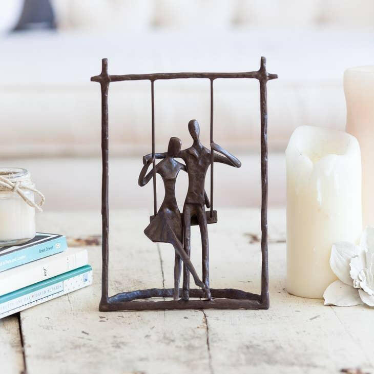 Couple on a Swing Cast Bronze Sculpture.