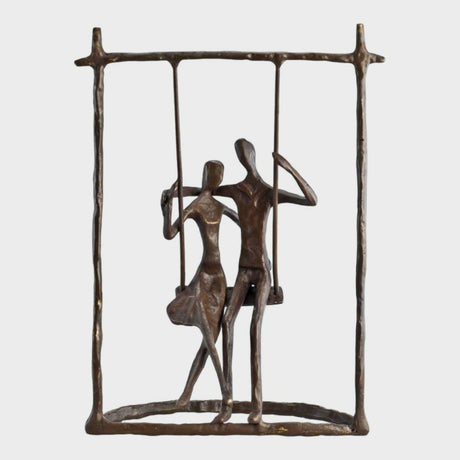 Couple on a Swing Cast Bronze Sculpture.